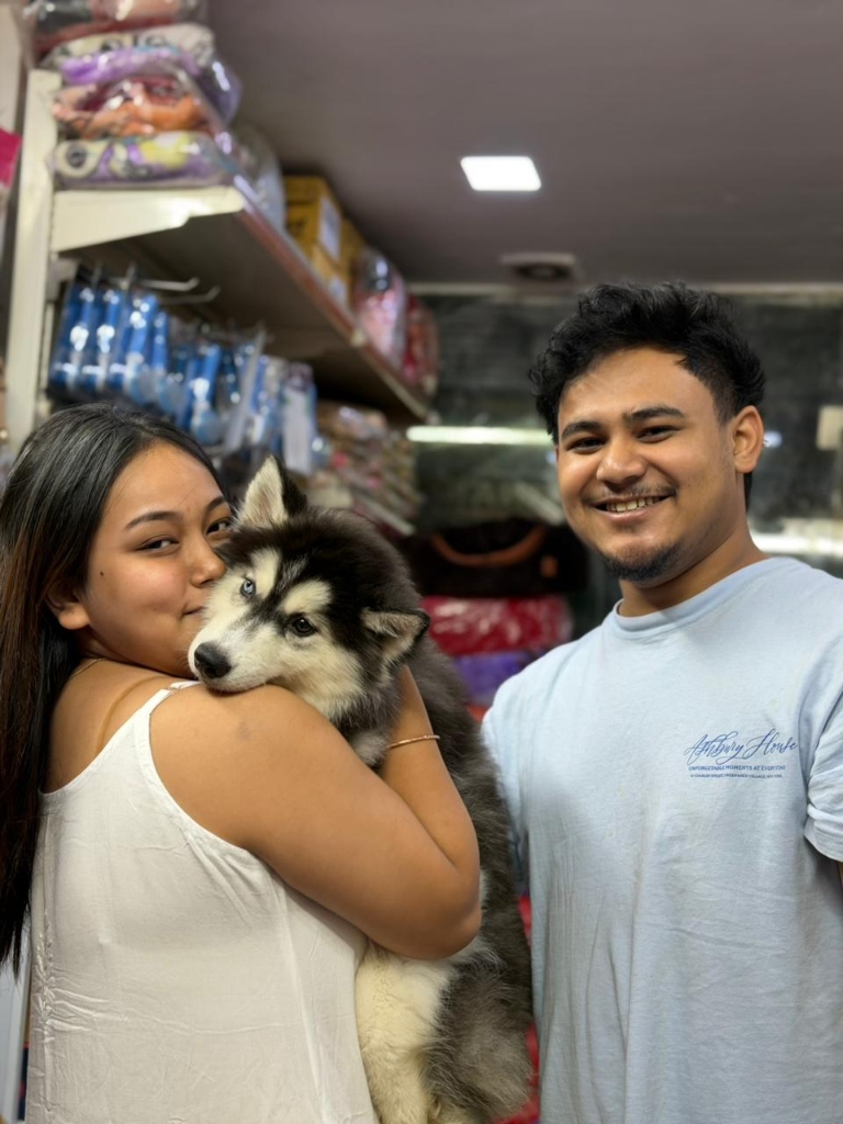 Happy customers with their new puppies